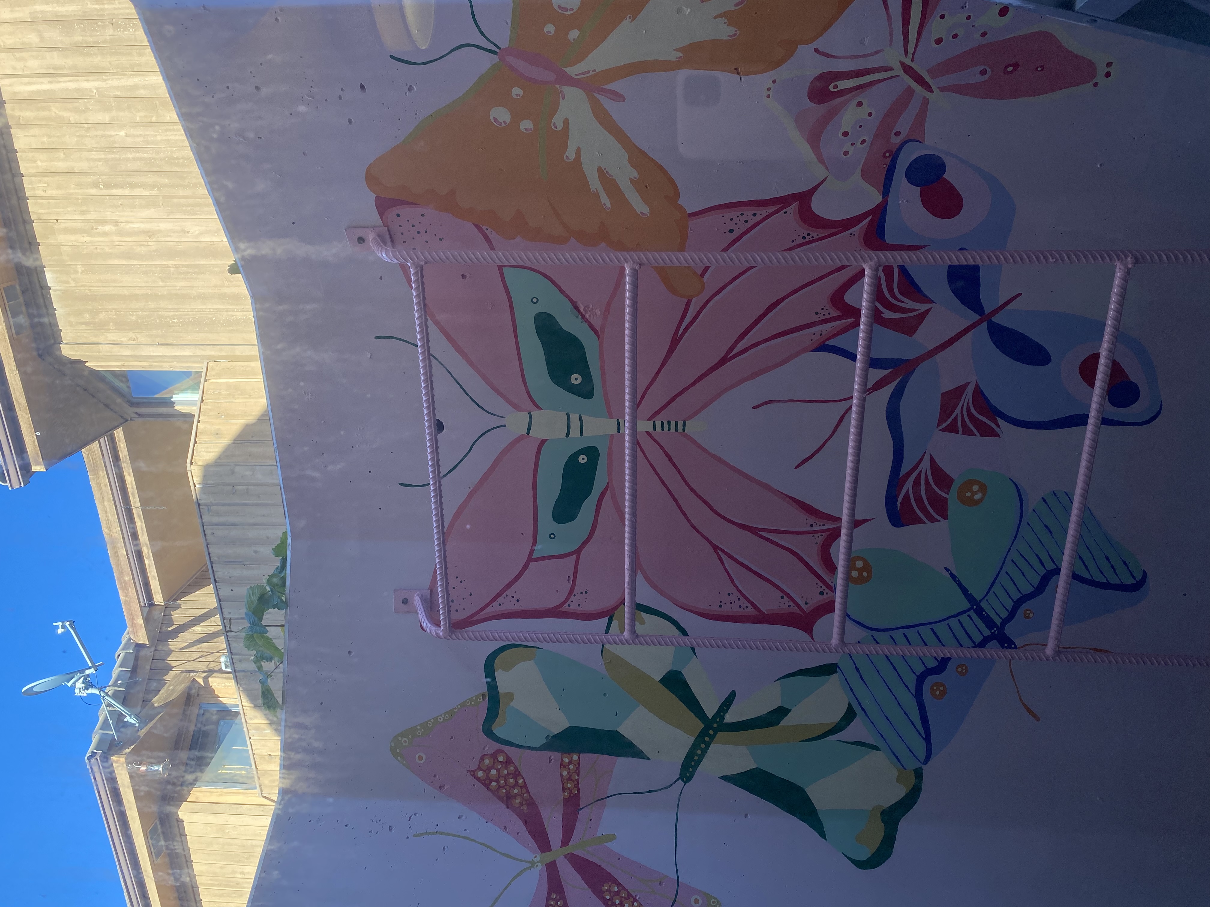 Rainbow bedroom mural with chandelier